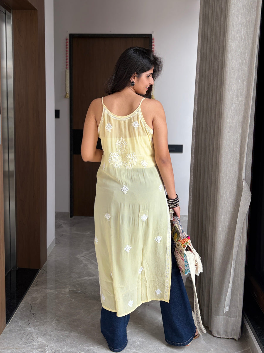 Yellow viscose noodle strap chikankari kurta - back view styled with wide-leg denim