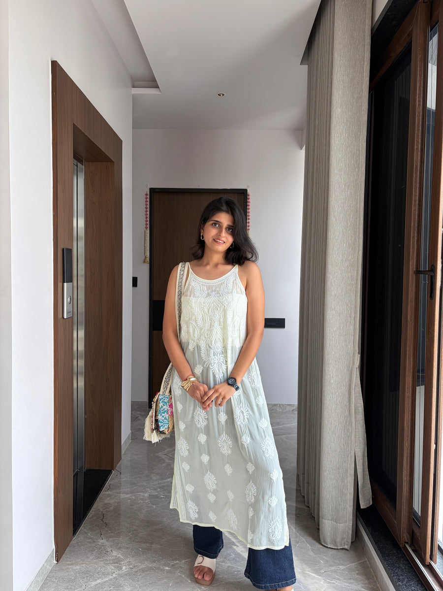 Blush pink viscose noodle strap chikankari kurta - side view paired with denim and sandals