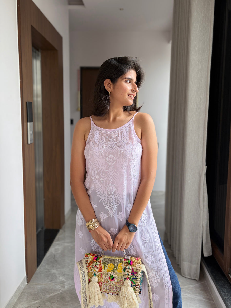 Blush pink viscose noodle strap chikankari kurta - three quarter view with embroidered potli bag