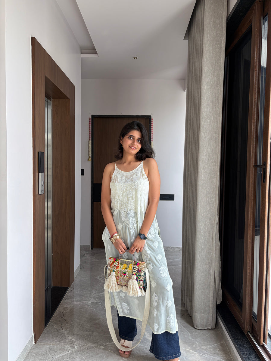 Blush pink viscose noodle strap chikankari kurta - full length front view with embroidered potli bag